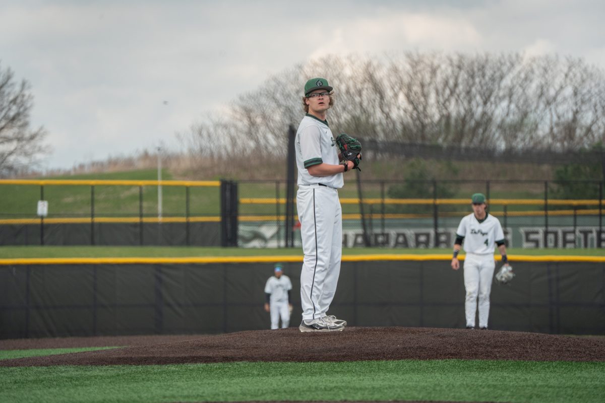 Number 3, Oliver Dew on the mound getting ready to throw.
