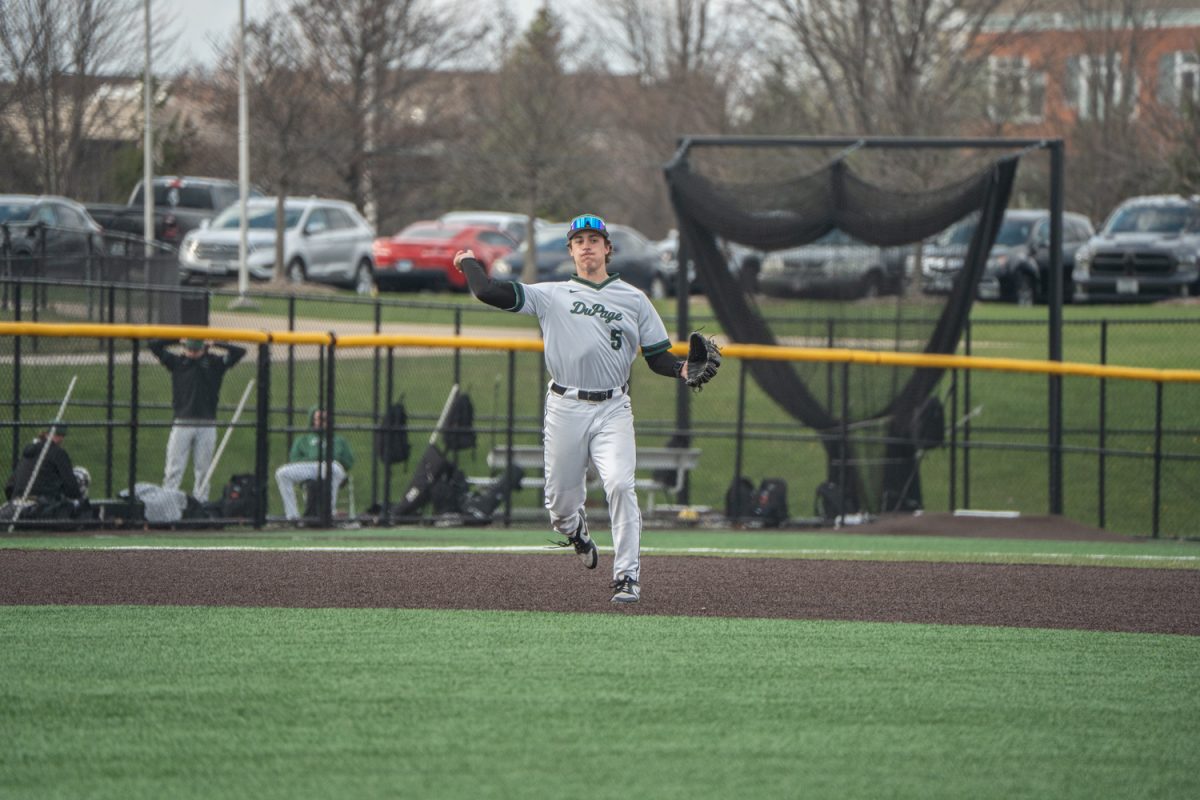 Number 13, Gavin Khoury about to throw the ball to first for a play.
