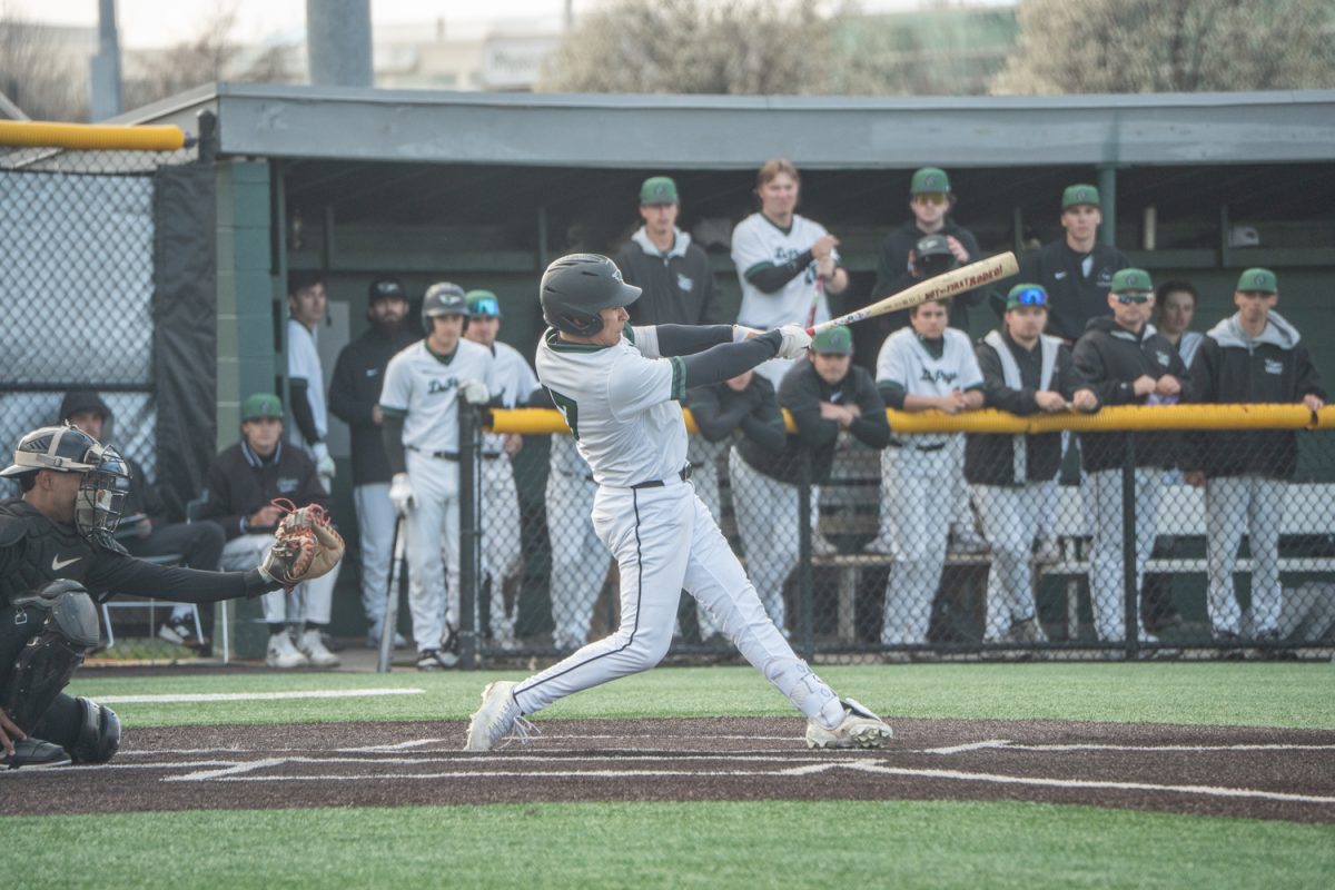 Number 17, Wilson Terrutty swinging his bat at a pitch.
