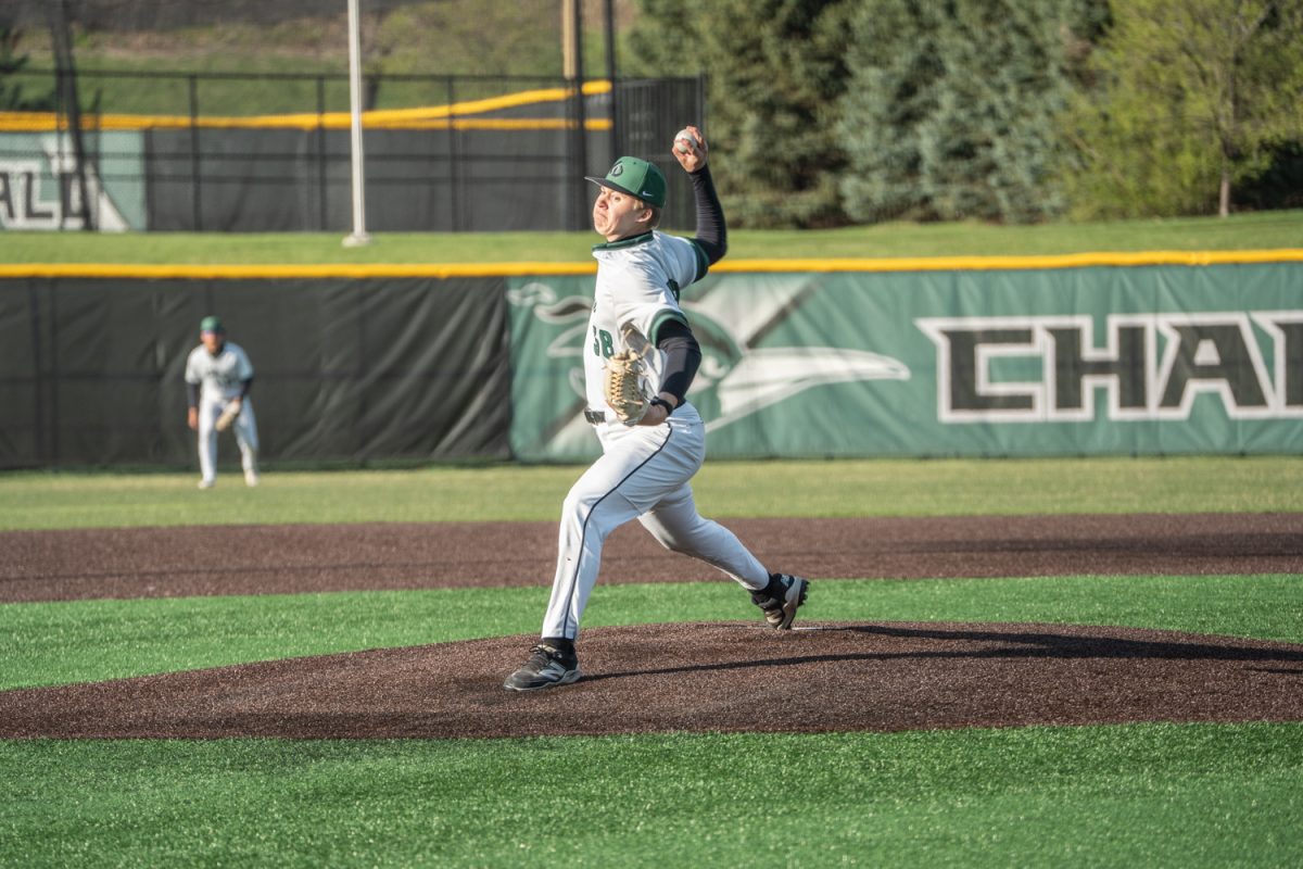 Number 38, Parker Friend in the motion of throwing a pitch.
