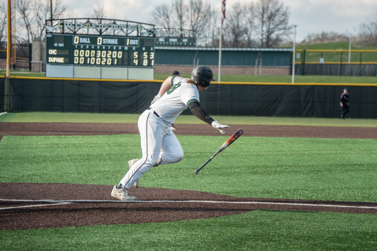 Number 28, Cullen Kleinsasser throwing his bat after hitting the ball.
