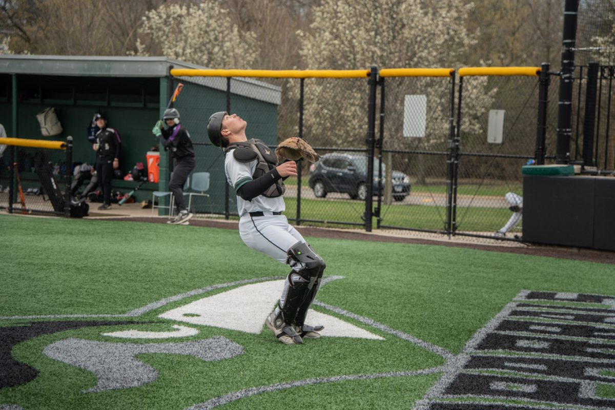 Number 20, Rocco Damato catching a popup.

