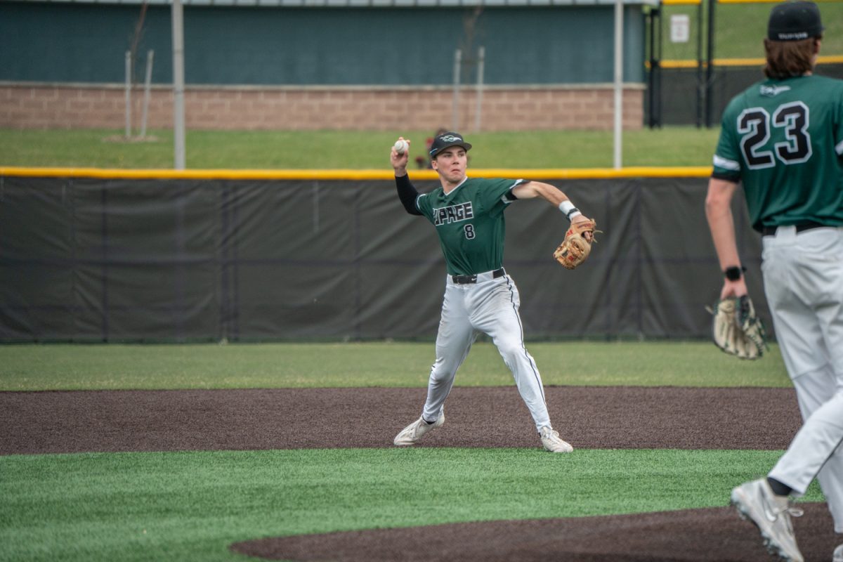 Number 8, Luke Fordonski with the ball about to make a throw to first.
