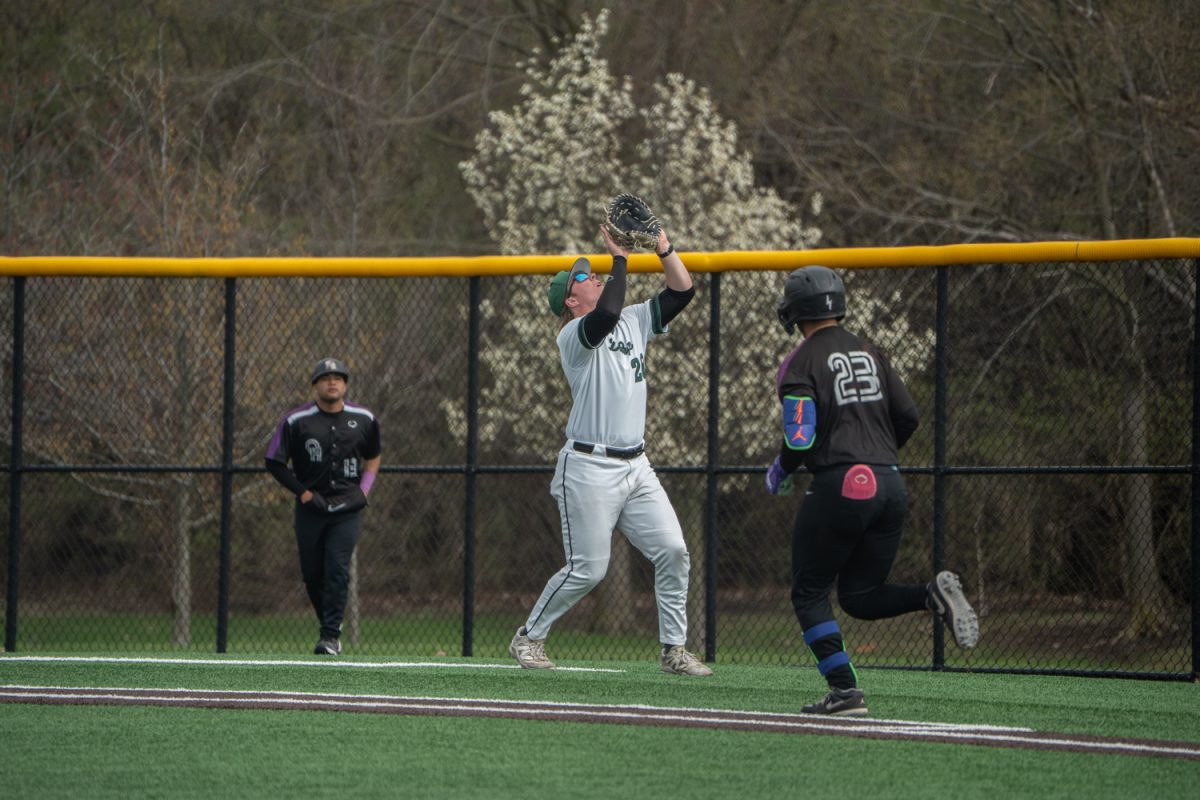 Number 28, Cullen Kleinsasser catches a ball in foul territory.
