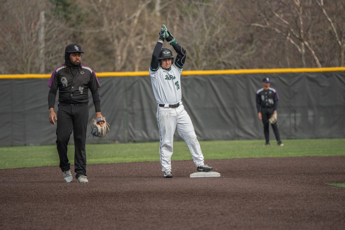 Number 16, Rocco Luciano doing a pose after hitting a double.
