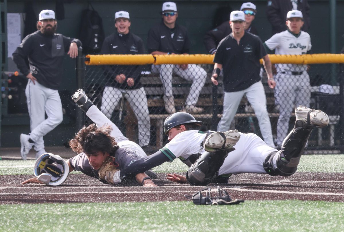 Rocco Damato tags the Moraine Valley player at home plate. 
