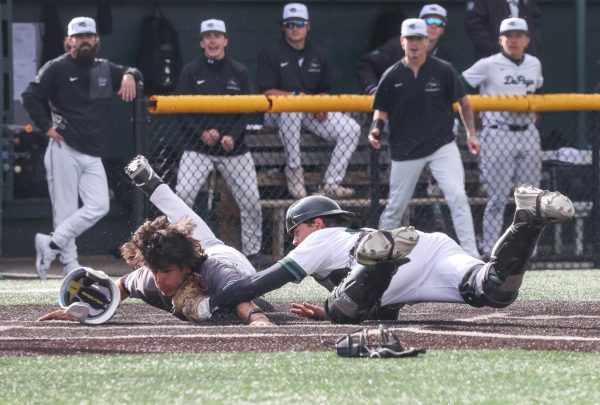 Rocco Damato tags the Moraine Valley player at home plate. 